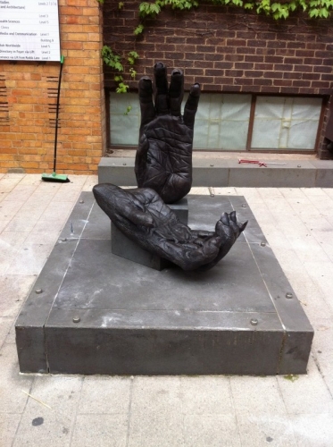 2019-04/chimp.-hands-bronze-blue-stone-1.5m-x2m-x1mroyal-melbourne-institute-of-technology-public-sculpture-bronze-bowan-lane-melbourne-city